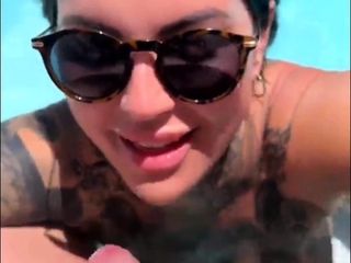 Tattooed british MILF pool blowjob